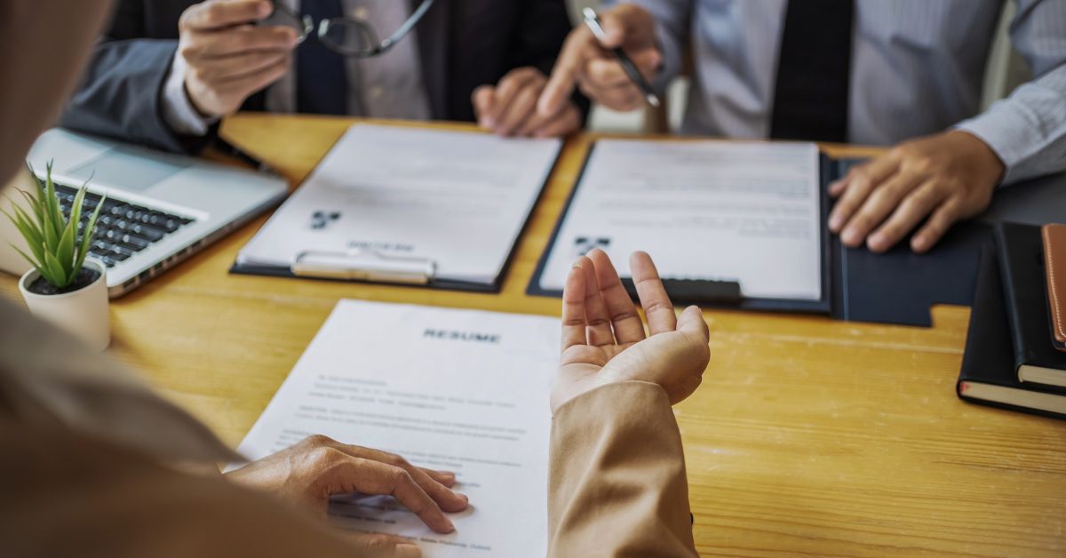 Close-up of an HR consulting session focused on workforce planning and resume review.